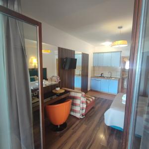 a hotel room with a bed and a living room at Apartments Villa Kresic in Neum +149 photos