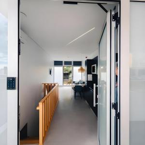 a hallway of a house with a sliding glass door at SociaLodge - Piornais in Funchal