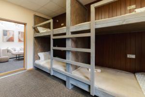 a bedroom with bunk beds in a room at Hang The Hat in Valmiera