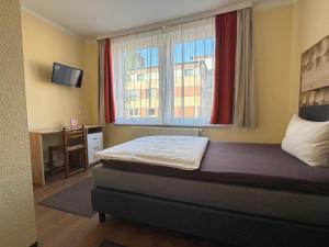 Llit o llits en una habitació de Hotel Sieme
