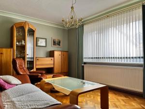 a living room with a couch and a table at Haus Anne und Peter in Fischbach