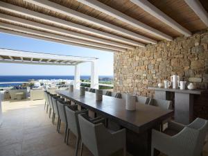 a dining room with a table and chairs at ABSOLUTE PARADISE in Paradise Beach