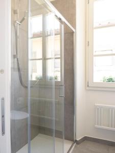 a shower with a glass door in a bathroom at La Chicca Appartamento Superior Fucecchio in Fucecchio +15 photos
