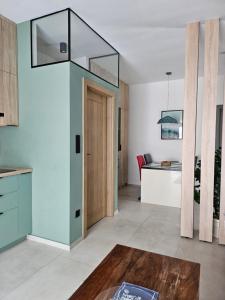 a kitchen and dining room with a glass ceiling at Studio apartmen in Budapest