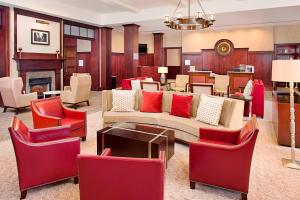 a living room with a couch and chairs at Sheraton Rockville Hotel in Rockville +16 photos