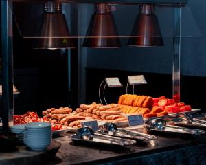 a buffet with different types of food on a table at La Living Collection in Ho Chi Minh City