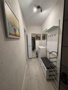 a room with a hallway with a staircase and a room with a stair case at Sweet Escape Varna in Varna City