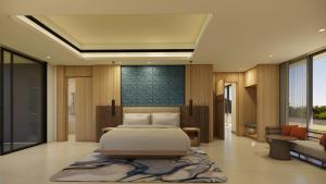 a bedroom with a bed and a living room at Mövenpick Resort Carita in Serang +15 photos