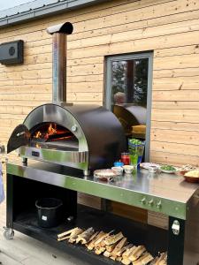 a oven on a table with some food on it at Skagenhaugen Private Lodge in Bø i Vesterålen +50 photos