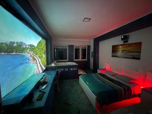 a bedroom with a bed and a view of the water at Suite al mare in Taranto