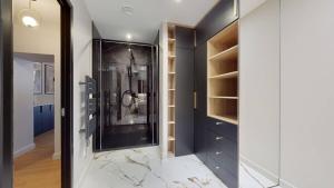a bathroom with a walk in shower and a mirror at Le Petit Piron in Dijon +10 photos