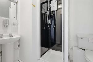 a bathroom with a shower and a sink at The Forest- Deepwood in Cambridge