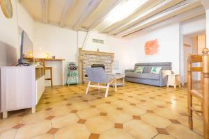 a living room with a couch and a table at La Cabotte d'Ahuy in Ahuy +8 photos