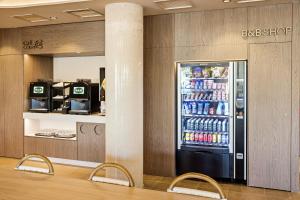 a soda shop with a soda machine in a lobby at B&B HOTEL Cieza in Cieza