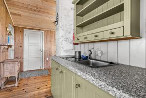 a kitchen with a sink and a counter top at Panoramic View - near Pulpit Rock in Strand