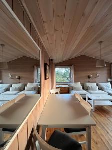 a room with tables and couches in a building at Panoramic View - near Pulpit Rock in Strand