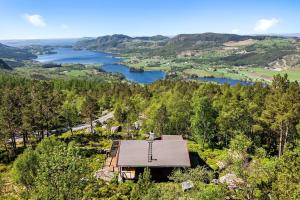 a house on a hill with a view of a lake at Panoramic View - near Pulpit Rock in Strand