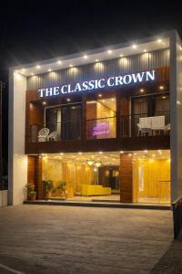 a building with a sign that reads the glass mosaic crown at Hotel Classic Crown - #Scenic mountain view #open terrace #guest preferred #best selling hotel in Mussoorie in Mussoorie