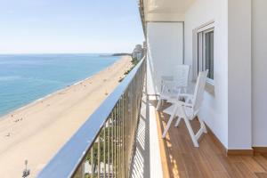 a balcony with a view of the beach at Pis Embaixador - 1a línea de mar in Platja d'Aro