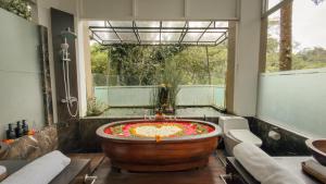 a large bathroom with a large bath tub with a large bowl at Villa Kalisha - Romantic, Seclusion in the heart of Nature in Tegalalang