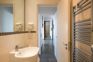 a bathroom with a sink and a mirror at Casa Leucosia in Capri +15 photos