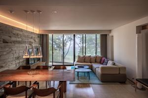 a living room with a couch and a table at Kozue in Kutchan