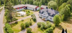 an aerial view of a large house with a garage at Marieborg Apartments in Ekshärad