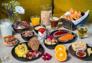 a table with a bunch of different types of breakfast foods at B&B HOTEL Cap d'Agde Bessan in Bessan +18 photos