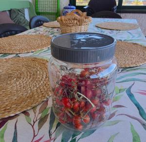 a jar of berries sitting on a table at FINCA LA JORADITA in Tamaduste +29 photos