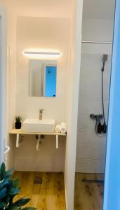a bathroom with a sink and a mirror at Casa de Oaspeti 2 Mai in 2 Mai