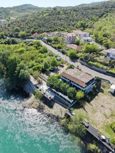an aerial view of a building next to the water at Ergi Riverside Villas in Zues
