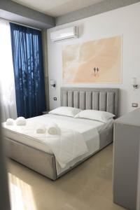 a bedroom with a large white bed in a room at Ergi Riverside Villas in Zues +68 photos