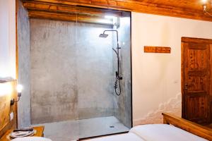 a shower with a glass door in a bathroom at Anhel Hotel in Berat +70 photos
