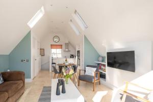 a living room with a couch and a table at York House in Aldeburgh