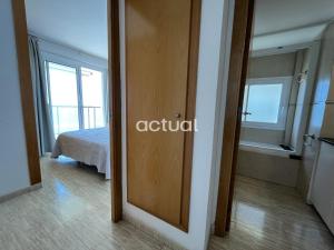 a room with a door to a bedroom with a bed at President A-9 in Platja d'Aro +30 photos