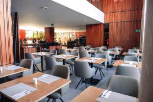 a dining room with wooden tables and chairs at Longue vie Hotels in Marrakesh +100 photos