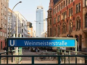 a blue sign that reads weminitzeritzeridate in a city at Numa Berlin Weinmeister in Berlin