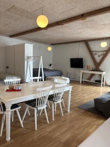 a living room with a table and chairs at Bolding Apartments in Billund