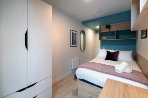 a bedroom with a bed and a tv at Stoneybatter Place in Dublin