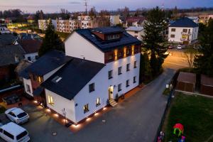 an overhead view of a white house with lights at Aparthotel Svitavy in Svitavy