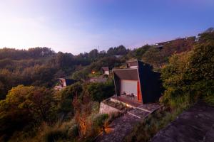 a small house on top of a hill at ARTOTEL Cabin Bromo in Bromo