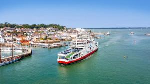 a large boat is docked in a harbor at Settle in Southampton - Stylish Self Check-In Rooms & Suites in Southampton