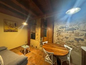 a living room with a table and a couch at APARTAMENTOS La Colmena APT - 1 - AT-CC-00248 in Gata