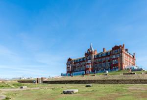 a large building in the middle of a field at 11 Zinc in Newquay in Newquay
