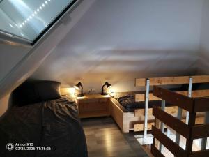 a bedroom with two bunk beds and a ladder at Pehely Vendégház in Lesencetomaj