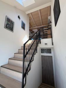 a staircase in a house with wooden ceilings at Apartmán Ve Štítu in Lomnice nad Popelkou