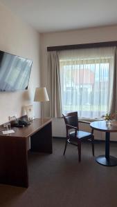 TV a/nebo společenská místnost v ubytování Hotel Farma