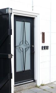 a black door with a star on it at Zuidzuidwest in Zierikzee