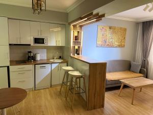 a small kitchen with a couch and a table at A & A GLOBAL PROPERTY RENTALs in Yerevan