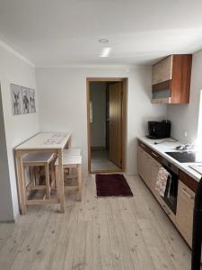 a kitchen with a counter and a table in it at Cozy cabin near Peipsi in Raja